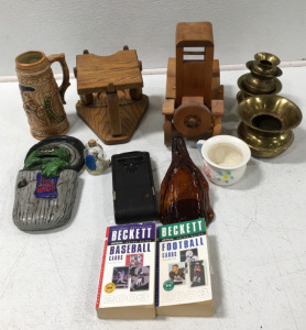 Lots Of Different Wooden, Glass, And Brass Home Decorations
