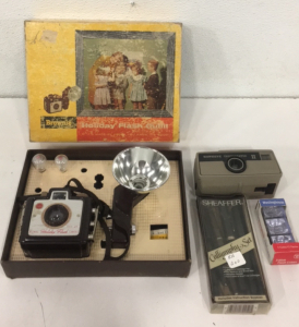 (1) Vintage Kodak Brownie Holiday Flash Camera In Original Box With Accessories (1) Sheaffer Caligraphy Set (2) Kodak Hawkeye Camera (3) Westinghouse Flash Cubes