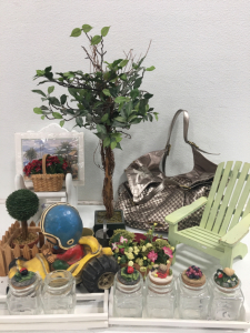 (4) Assorted Artificial Flowers (1) Green Mini Lawn Chair (1) Elliott Lucca Purse & More!