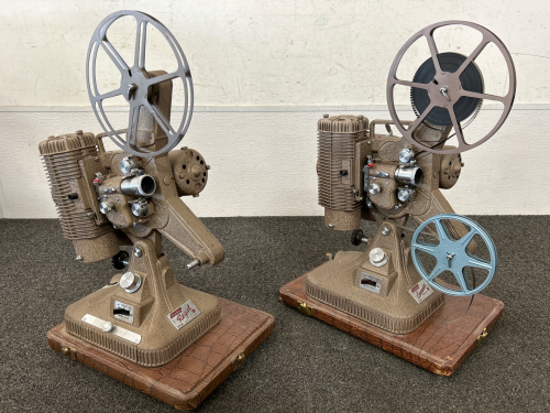 Always a conversation piece, these Antique Projectors will grab your guests attention quick!! Keystone Commander Deluxe Model K-108 (has film!!) & Keystone Regal Model K-109 (for display only).