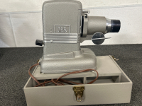 Collect a piece of film history with these Antique Film Projectors!! TDC (a division of Bell & Howell) Deluxe Model D in Air Floe Case and a Bell & Howell Auto Load Midel 245 PA (for display only). - 2