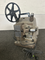 Collect a piece of film history with these Antique Film Projectors!! TDC (a division of Bell & Howell) Deluxe Model D in Air Floe Case and a Bell & Howell Auto Load Midel 245 PA (for display only). - 5