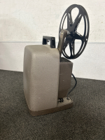 Collect a piece of film history with these Antique Film Projectors!! TDC (a division of Bell & Howell) Deluxe Model D in Air Floe Case and a Bell & Howell Auto Load Midel 245 PA (for display only). - 6