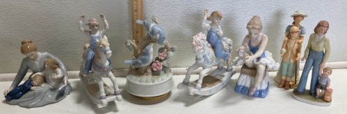 (7) Ceramic Collectible Figurines: (2) Children on Rocking Horses, (1) Ballerina, (1) Mother w/ Children, (1) Musical Birds, (2) Mother w/ Son