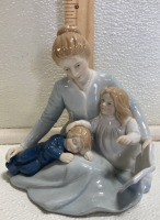 (7) Ceramic Collectible Figurines: (2) Children on Rocking Horses, (1) Ballerina, (1) Mother w/ Children, (1) Musical Birds, (2) Mother w/ Son - 7