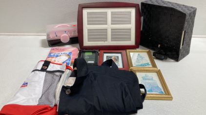 (3) Picture Frames, Box of Sewing Notions, Women’s Rain Jacket, (2) Framed Bathroom Wall Art, Computer Camera and more