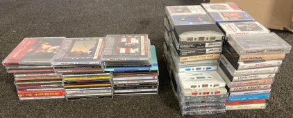 34 CDs And 83 Cassette Tapes