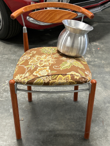 Decorative Accent Chair and Silver Colored Spitoon