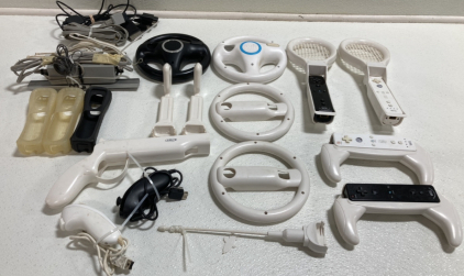 Assorted Wii Accessories: (4) Remotes, (4) Wheels, (2) Rackets, (2) Golf Clubs, and more