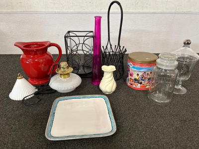 VINTAGE JARS, CONTAINERS, VASES, RED PITCHER, PLATE WITH BLUE/BLACK/GRAY BORDER, VINTAGE LAMP, CANDLE HOLDERS.