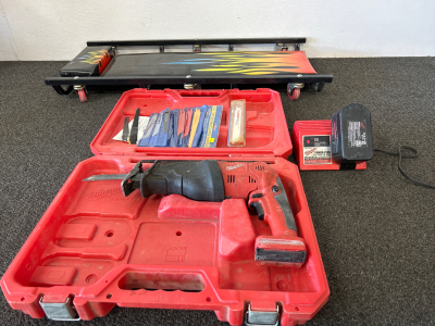 MILWAUKEE CORDLESS SAWZALL &ldquo;THE HATCHET&rdquo; (WORKS!) WITH BATTERY, CASE AND CHARGING STATION, EXTRA BLADES, PLUS MECHANICS CREEPER WITH EASY TO CLEAN COVER