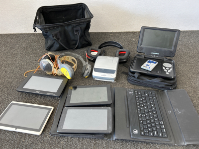 SYLVANIA PORTABLE DVD PLAYER WITH REMOTE (NO CHARGER), BLUETOOTH KEYBOARD FOR TABLETS, DIGITAL E-BOOK READERS, POLAROID FILM CAMERA (WEAK BATTERIES), 2 PAIRS OF HEADPHONES, RADIO HEADLHONES AND BAG TO CARRY IT ALL.