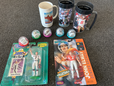 2 JOHN ELWAY FIGURINES, 5 MINI CUPS: BRONCOS, SAINTS, RAVENS, LIONS & STEELERS, 3 49ER&rsquo;S TALL MUGS, PLUS MLB M.V.P. JOSE CONSECO COLLECTOR CARDS.