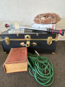 WORKING BROOKSTONE FOOT WARMER & MASSAGER, VINTAGE WEBSTER DICTIONARY FROM 1951, RECHARGEABLE WORK LIGHT (NO CHARGER TO TEST), JEWELRY MAKING KIT, NICE UNUSED STORAGE TRUNK, AND AN OUTDOOR EXTENSION CORD WITH 3 PLUG END.