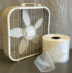 LASKO BOX FAN (POWERS ON) AND ROLL OF PLASTIC; PLEASE INSPECT