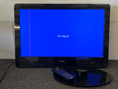 VIZIO TV WITH STAND AND REMOTE (POWERS ON) AND DOES SHOW SOME DAMAGE; PLEASE INSPECT