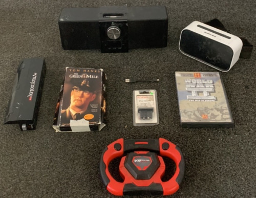 LOGITECH ALARM/RADIO COMBO (NO POWER CORD DOES NOT TURN ON) SHARPER IMAGE PHONE VR, IPOD SHUFFLE INTERCHANGEABLE TIPS, THE GREEN MILE VHS AND THE HISTORY CHANNEL WORLD WAR 2 CD AND MORE