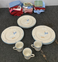 (8) BRICK OVEN STONEWARE AUNT RHODY PLATES W/ (3) BRICK OVEN STONEWARE MUGS AND DISH TOWELS W/ POT HOLDERS, SILVERWARE, MEASURING CUPS AND MORE; PLEASE INSPECT - 2