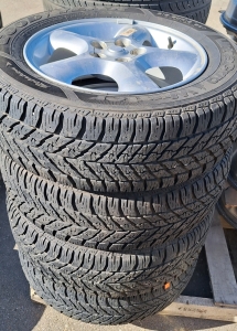 GOODYEAR ULTRAGRIP WINTER TIRES ON FORD 5-BOLT WHEELS. 215/60R16