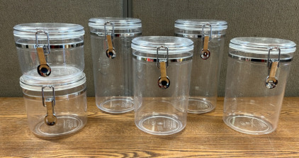 (6) OGGL CLEAR CANISTERS W/ AIR TIGHT CLAMP LIDS; PLEASE INSPECT