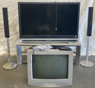 TWO BOX TV WITH REMOTES (DOESNT WORK), MEDIA STAND, TWO SONY FREE STANDING SPEAKERS ( UNTESTED)