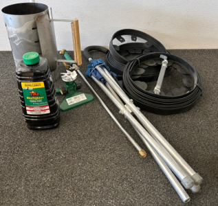 GARDEN MATERIALS INCLUDING TIKI TORCH FUEL, SPRINKLER, CHARCOAL CHIMNEY, LANDSCAPING EDGING AND MORE