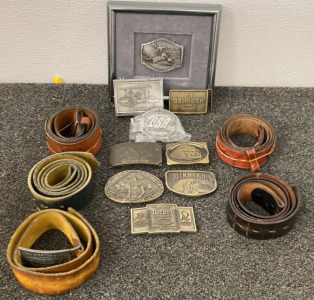 LEATHER BELTS AND BUCKLES INCLUDING LEEGIN BELT, LEVI STRAUSS BELT, OSHKOSH TRUCKS BELT BUCKLE, CATERPILLAR PRODUCTS BUCKLE, 1987 USA SHOOTING TEAM BUCKLE AND MORE