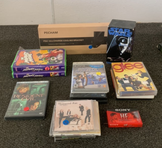 PS4 SLIM CHARGE COOLING BRACKET, (2) THE MUPPET SHOW ON VHS, STARWARS TRILOGY ON VHS, WII GAMES, AND MORE