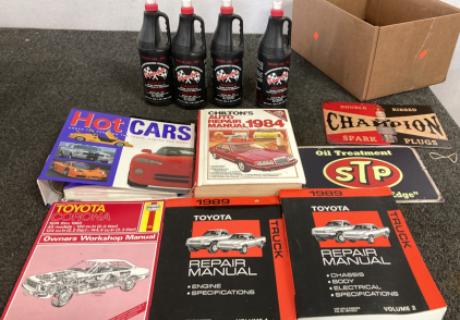 TOYOTA REPAIR BOOKS, 2 SMALL METAL SIGNS, AND 4 BOTTLES OF RACING LUBRICANT