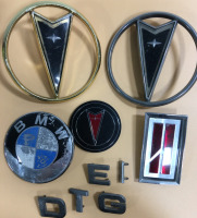 (5) Vintage Original Hood Emblems & Letters Including (1) Oldsmobile (3) Pontiac (1) BMW & Letters D-G-E-T-I