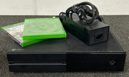XBOX ONE GAMING SYSTEM WITH POWER CORDS AND TWO GAMES: ASSASSINS CREED UNITY. THE GAME SYSTEM POWERS ON AND IS IN GREAT CONDITION.