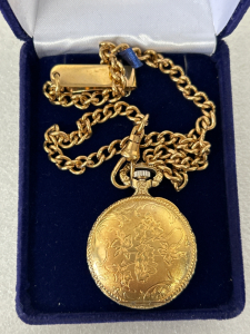 VINTAGE WALTHAM POCKET WATCH WITH CHAIN AND CASE IN WORKING CONDITION.