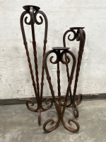 3 WRAUGHT IRON CANDLE PILLAR STANDS (S/M/L 30”, 36” & 42”) AND A WRAUGHT IRON SUN CANDLE PILLAR (46” TOP TO BOTTOM) - 3