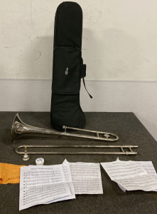 TROMBONE WITH CASE AND MUSIC SHEETS