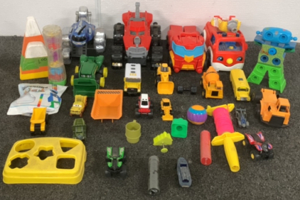 BOX OF PLASTIC TOY TRUCKS, CARS, AND MORE