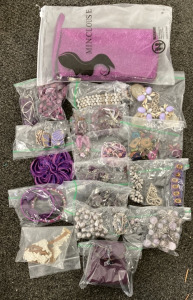 BOX OF PURPLE COSTUME JEWELRY