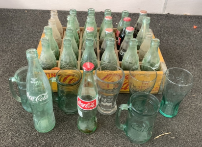 VINTAGE GLASS COCA-COLA BOTTLES AND MUGS WITH WOODEN COCA-COLA CRATE