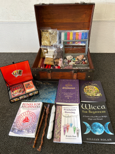 WOOD CHEST WITH VARIOUS CRYSTALS, CANDLES, HERBS, TAROT CARDS AND BOOKS FOR SPIRITUAL KNOWLEDGE
