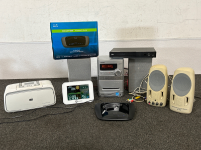 SMARTGEAR ALARM CLOCK/THERMOMETER (WORKS), SONY RADIO/CD/CASSETTE SYSTEM (RADIO & CD&rsquo;S WORK, UNABLE TO TEST CASSETTE), LG DVD PLAYER (NO CORD TO TEST), CISCO LINKSYS E1000 WIRELESS-N ROUTER (POWERS ON), COMPUTER SPEAKERS (POWERS ON) AND HP PHOTOSMART A536