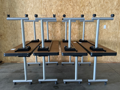 (8) ROLLING TABLES/ DESKS-59-1/2”x 19-1/2”x 29” (SOME TABLES MAY HAVE DAMAGED WHEELS)