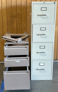 (2) METAL FILING CABINETS, THE 4-DRAWER FILING CABINET HAS NO KEY AND CANNOT OPEN