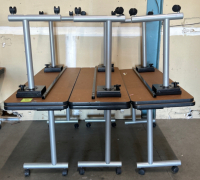 (6) ROLLING TABLES/ DESKS-59-1/2”x 19-1/2”x 29” (SOME TABLES MAY HAVE DAMAGED WHEELS)