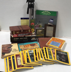 (18) Issues of National Geographic; Scrabble; Rummy Tile; Uno; Backgammon; Yellow Writing Pads; Tripod; World War II Documentary; Whole Health Catalogue; Route 66 The Mother Road; The Last Primitive People; Hammonds Library World Atlas; Picture Frame