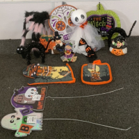 (1) HALLOWEEN THEMES OVEN MITT, (1) SET OF HALLOWEEN THEMED POT HOLDERS, (1) CERAMIC PUMPKIN CANDLE HOLDER, (2) CERAMIC FIGURINES, AND MORE