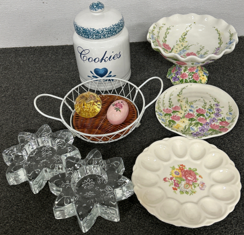 FLORAL PAINTED BOWL WITH MATCHING PLATE, DEVILED EGG SERVING PLATE, COOKIE JAR, GLASS CANDLE HOLDERS, CERAMIC PAINTED EGG, HAND BLOWN GLASS APPLE WITH 23K GOLD FLAKES INSIDE (UNVERIFIED) AND SMALL METAL FRAMED BASKET WITH WICKER INSERT