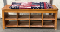 WOOD BENCH WITH 8 STORAGE CUBBIES AND A WOVEN FLAG THROW BLANKET