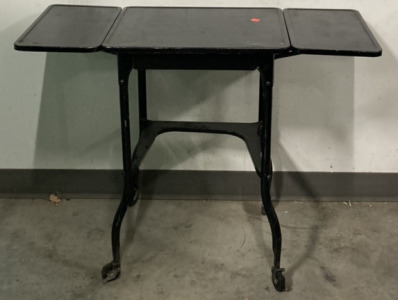 BLACK METAL FOLDOUT TABLE (35”X14.5”)