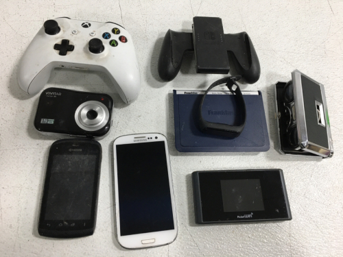 (1) Pocket WiFi (306ZT) Powers on (1) Wireless XBox One Control (1708) (1) Nintendo Switch Controller (1) Samsung Galaxy SIII (Doesn&rsquo;t Turn On) (1) Kyocera Cricket Phone (Locked) & More!