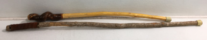 (2) Beautiful Walking Sticks (1) 50&rdquo; With Hand Carved Face & Leather Wrap (1) 40&rdquo; Tree Knot