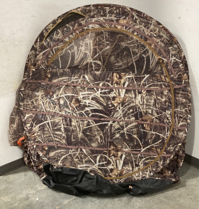 (1) REALTREE MAX-4 CAMO TENT WITH DUCK COMMANDER STORAGE BAG, AND STAKES.